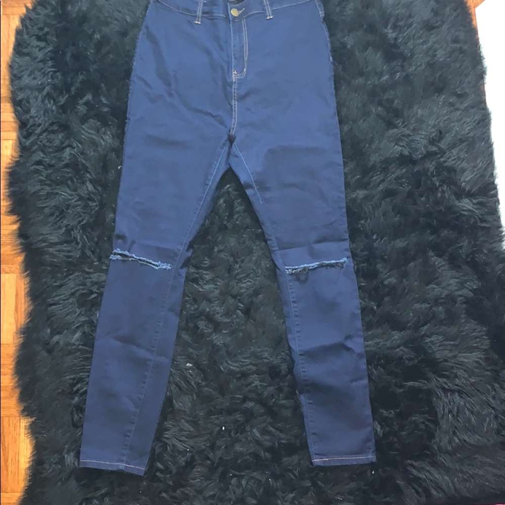 Dark wash slit knee skinny jeans